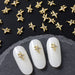 Nail Success Australia cross star rhinestone nail charms — gold 3D embellishments shown on white tips