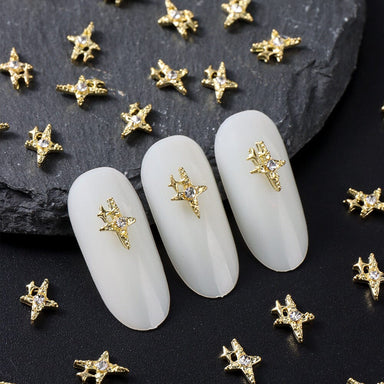 Nail Success Australia cross star rhinestone nail charms — gold 3D embellishments shown on white tips