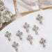 Silver cross rhinestone nail art charms — 3D studs N-8267, 6×9mm, set of 8 for DIY gel or acrylic nails