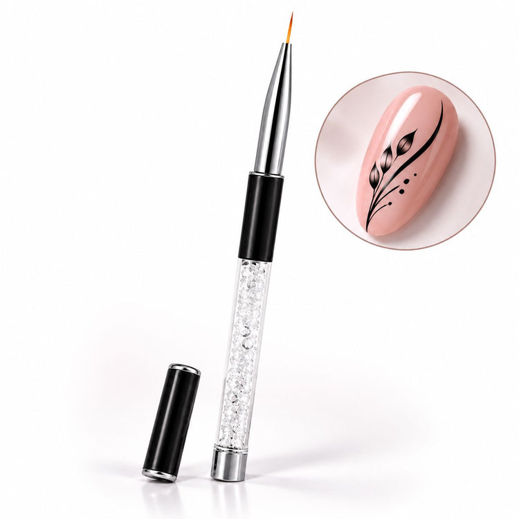 9 mm nail art liner brush with crystal-filled handle and black protective cap, shown beside a pink nail with black leaves and flowing lines.
