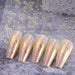 Gold curve-stripe line nail stickers sheet SW-A24 with abstract squiggles and dots; shown on iridescent chrome tips — NSI Australia