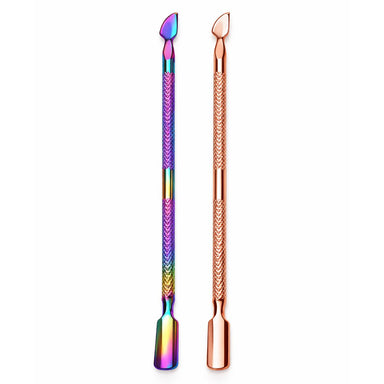Rainbow and rose gold double-ended cuticle pushers and scrapers shown side by side on a plain background