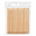 Bulk pack of wooden cuticle pusher sticks in a clear hanging plastic bag on a light gray background