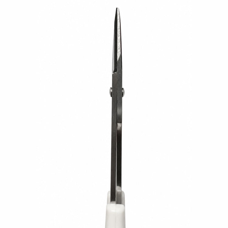 Side view of white handle cuticle scissors with stainless steel straight precision blades for detailed manicure trimming and nail care