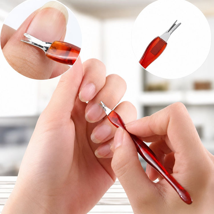 Red V-shaped cuticle trimmer and pusher nail tool being used for manicure cuticle care, NSI Australia