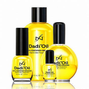 Four sizes of Dadi’Oil cuticle, nail and skin treatment in clear bottles with black caps, filled with golden oil.