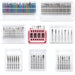 Collection of assorted diamond nail drill bit sets in rainbow and silver finishes, with clear storage cases and a pink display stand.
