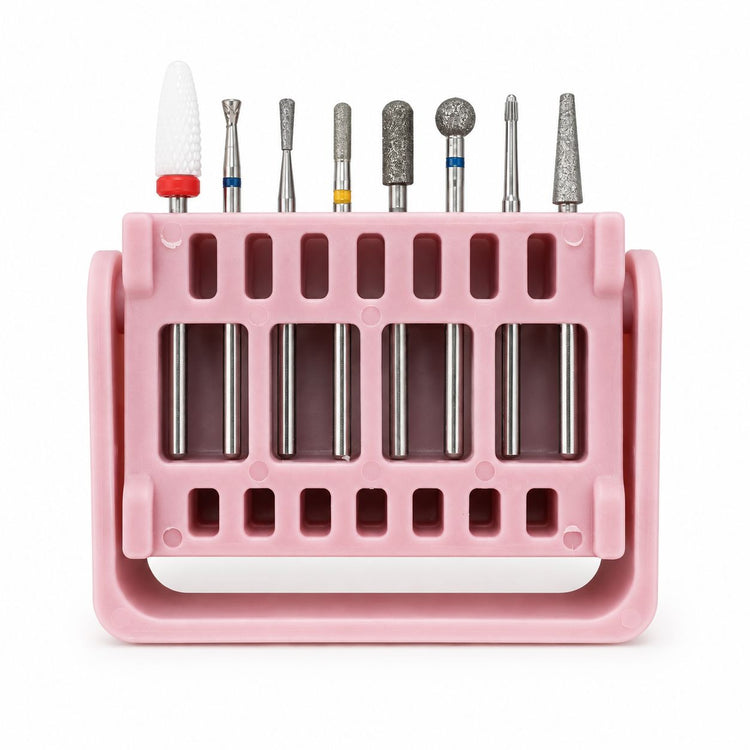 Eight-piece nail drill bit set with assorted ceramic and diamond bits displayed in a pink storage stand.
