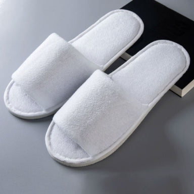 Pair of white disposable salon slippers, towel fabric, open toe