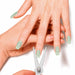 Two hands of green cat-eye nails with the silver scissor-shaped magnet tool held against a fingertip