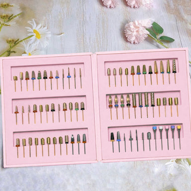 Professional nail drill bit kit with assorted carbide bits in pink storage case on floral background, NSI Australia