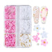 White & pink 3D flower nail art charms set — assorted daisies with pearls and gold beads in 6-grid box, shown on sample tips for DIY gel or acrylic nails