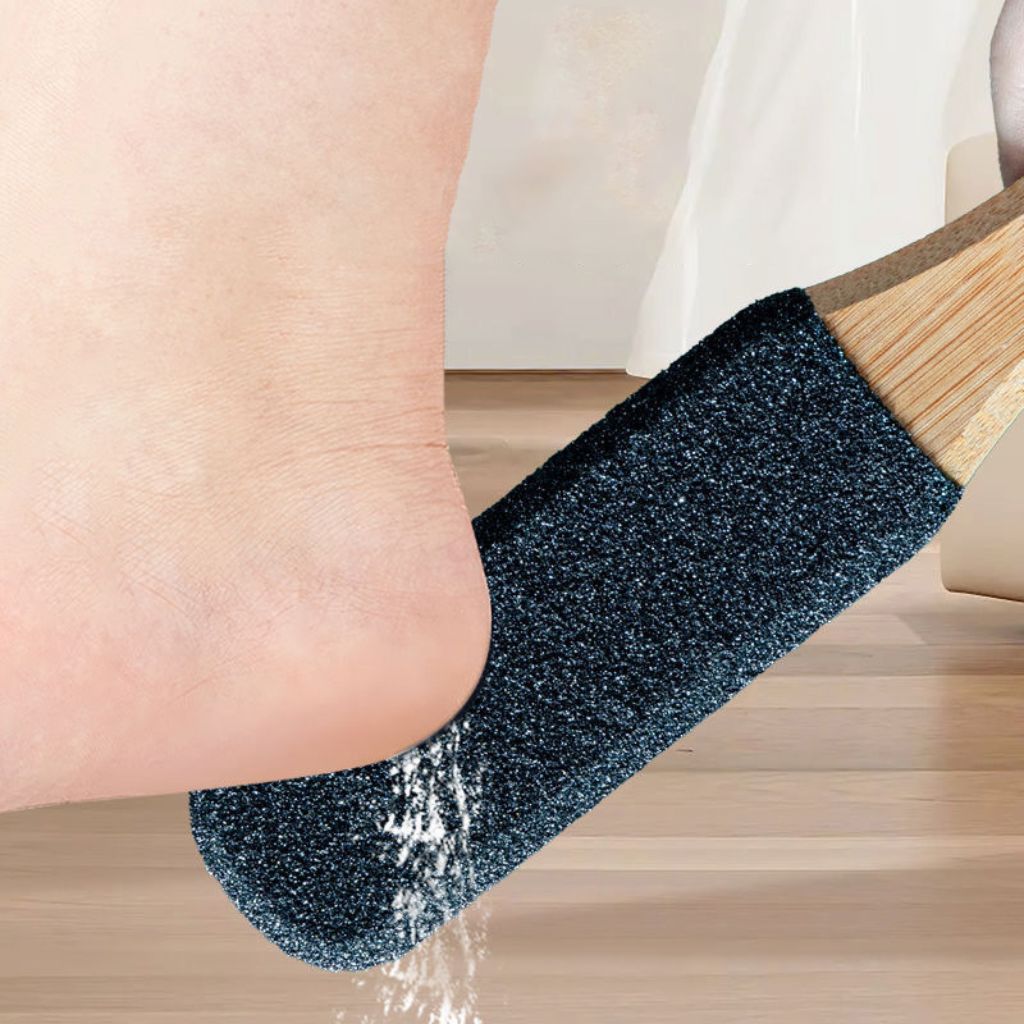 Pedicure foot file used on heel — coarse black grit, wooden handle, callus removal (NSI Australia)