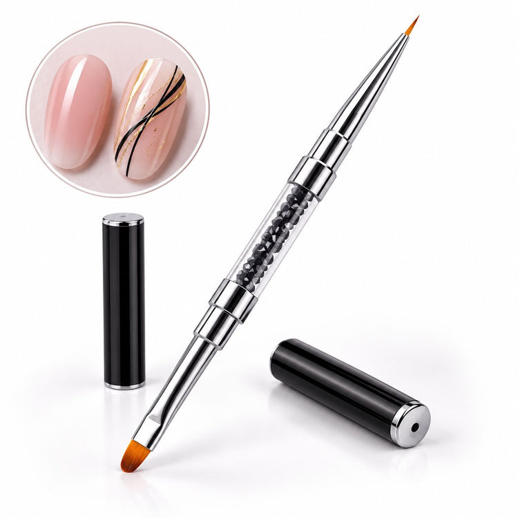 Double-ended gel and liner brush with black crystal-filled handle and protective caps, shown with black and gold nail art on pink nails.
