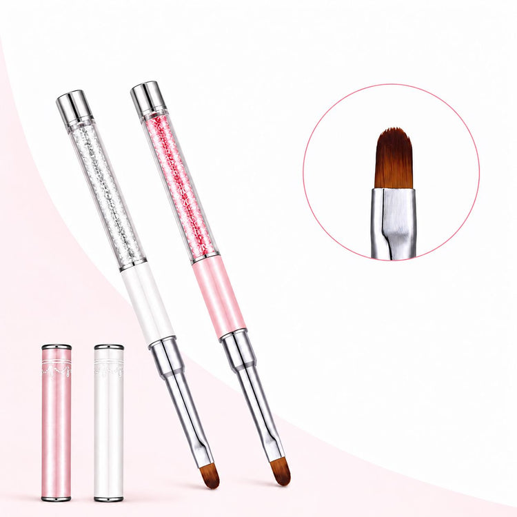 Pink and white gel nail brushes with crystal-filled handles, oval brown bristles and matching protective caps, shown with a brush tip close-up.
