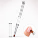 White gel nail brush with oval bristles, a crystal-filled handle and matching cap, shown applying pink gel to a natural nail.
