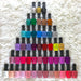 Sina Life’s Complete collection of 48 gel polish bottles in bright, pastel and neutral colours, arranged in a pyramid on white textured fabric.
