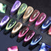 Born Pretty Holo Reflective Magnetic “cat-eye” gel polish set — 6 galaxy shades (purple, green, champagne gold, rose, magenta, blue) on long coffin swatches with sparkling finish on a dark background