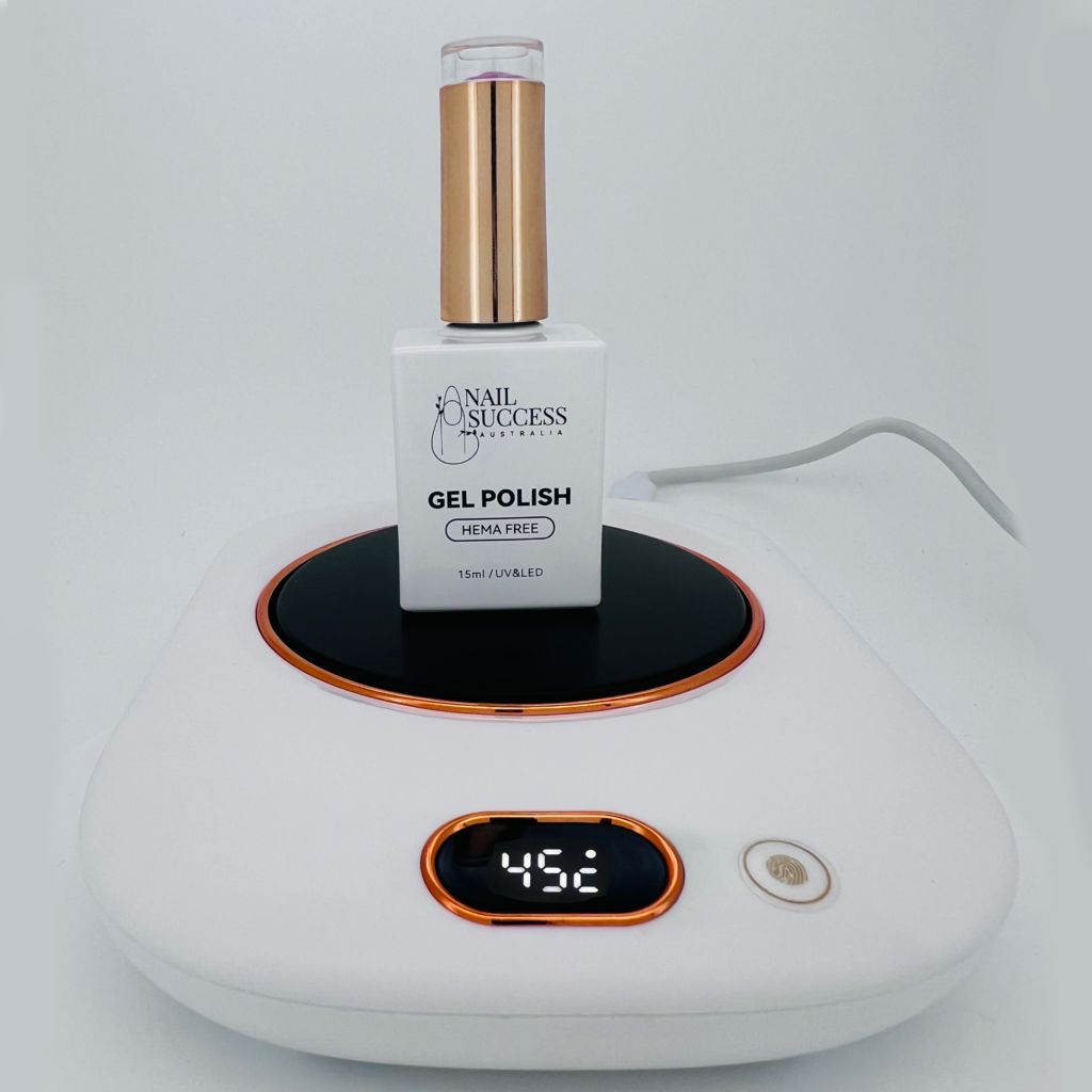 NSI Australia Gel Polish Warmer—heat plate warming Nail Success gel polish bottle; digital display reads 45°C