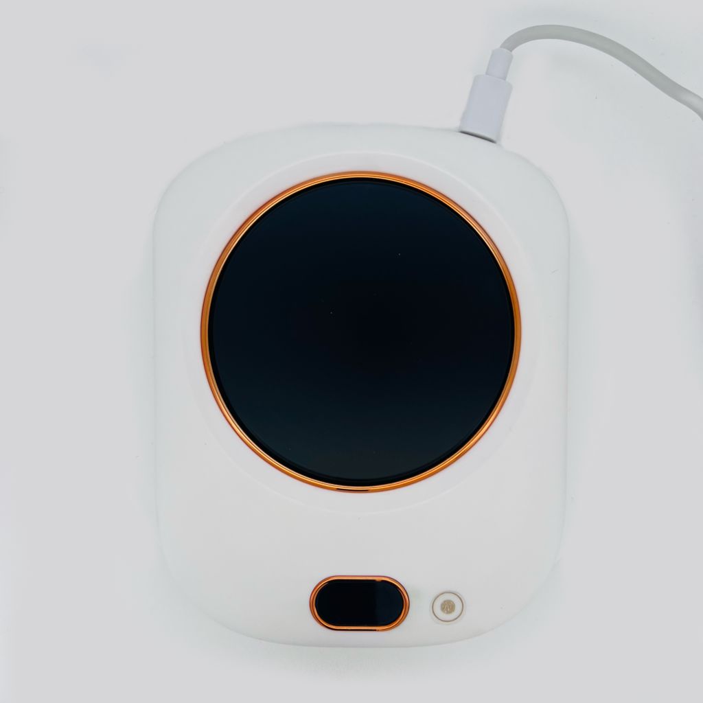 NSI Australia Gel Polish Warmer—USB heat plate for warming gel polish bottles; compact white unit with round black surface