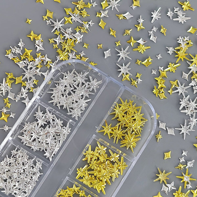 Gold and silver mixed star nail charms in organiser tray for 3D celestial nail art decorations and salon manicure designs