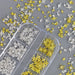 Gold and silver mixed star nail charms in organiser tray for 3D celestial nail art decorations and salon manicure designs
