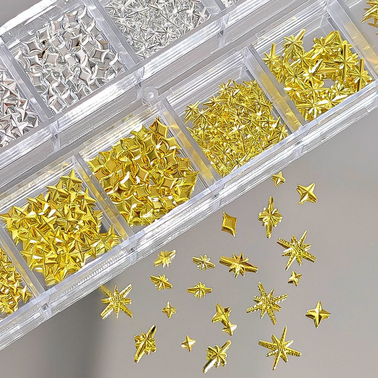 Gold and silver mixed star nail charms in organiser tray for 3D celestial nail art decorations and salon manicure designs