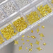 Gold and silver mixed star nail charms in organiser tray for 3D celestial nail art decorations and salon manicure designs