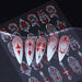 White, red and silver gothic nail art sticker sheet shown with example long nail designs