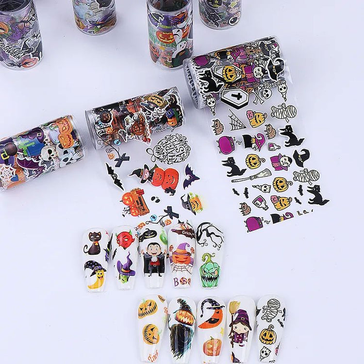 Halloween nail transfer foil rolls — spooky nail art designs with pumpkins, witches, skulls and sample nail tips