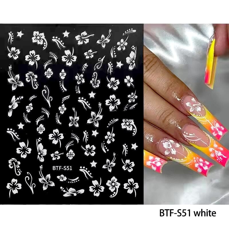 White hibiscus flower nail stickers (BTF-S51) with swirls and stars on black sheet