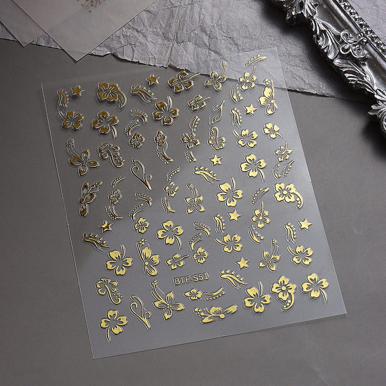 Nail Success Australia BTF-S51 gold hibiscus flower nail stickers with floral, star and swirl designs on display sheet