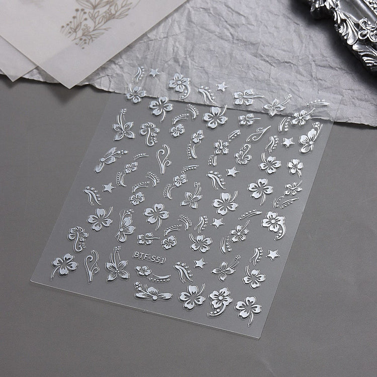 Nail Success Australia BTF-S51 silver hibiscus flower nail stickers with floral, star and swirl designs on display sheet