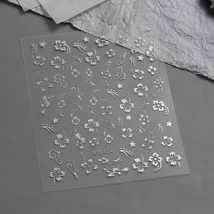Nail Success Australia BTF-S51 white hibiscus flower nail stickers with floral, star and swirl designs on black backing sheet