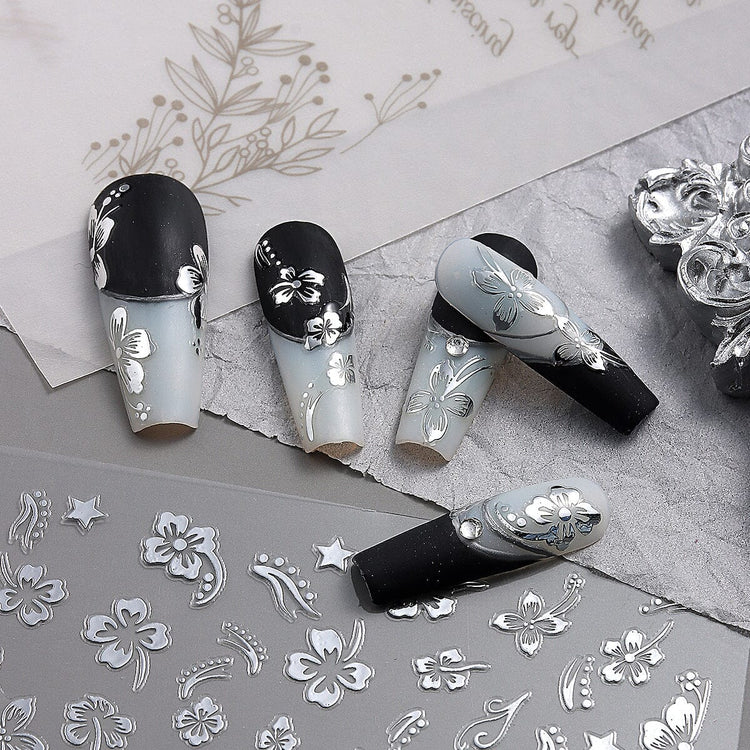 Nail Success Australia silver hibiscus flower nail stickers shown with black and grey floral manicure designs