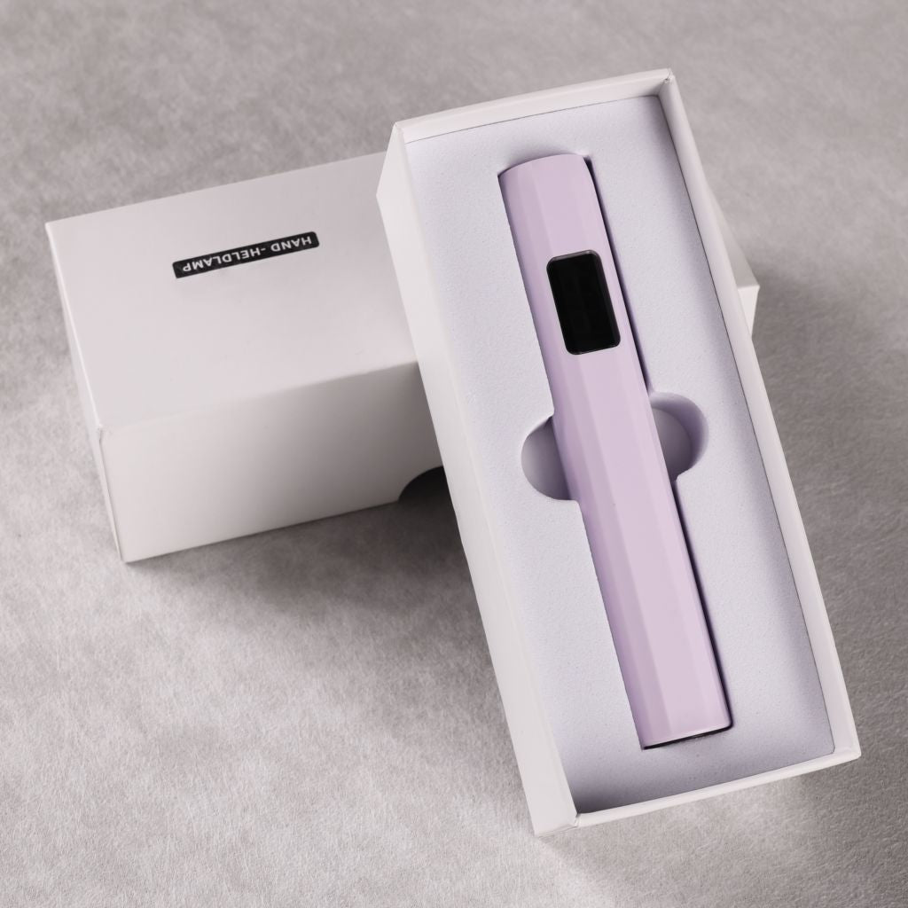 USB-rechargeable LED nail flash-cure torch—lavender pen-style lamp with digital display in foam box, by Nail Success Australia