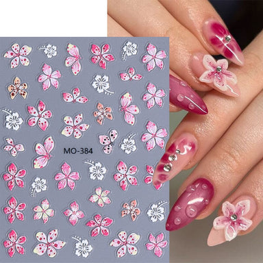 MO-384 Lily and Hibiscus Flower Nail Art Sticker sheet with pink and white floral designs on manicure sample