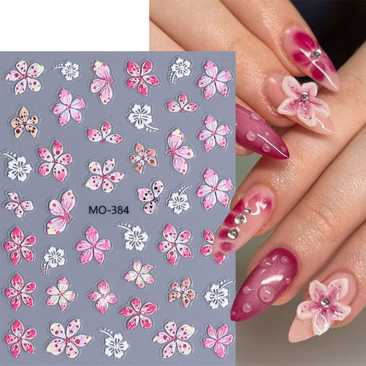 MO-384 Lily and Hibiscus Flower Nail Art Sticker sheet with pink and white floral designs on manicure sample