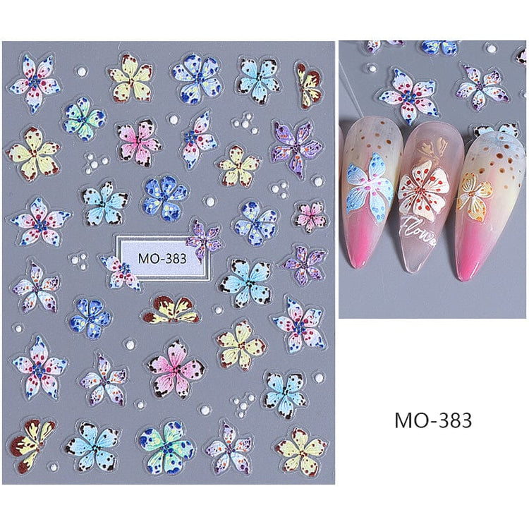 MO-383 Lily and Hibiscus Flower Nail Art Sticker sheet with pastel blue, pink, yellow and white floral designs on manicure samples