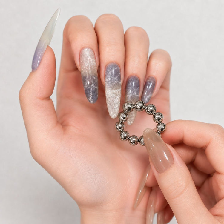 Manicured hand holding 20-piece 5 mm magnetic beads for blooming cat-eye gel polish nail art – NSI Australia
