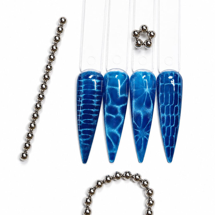 5 mm magnetic beads creating blooming cat-eye effects on blue gel polish nail tips – NSI Australia