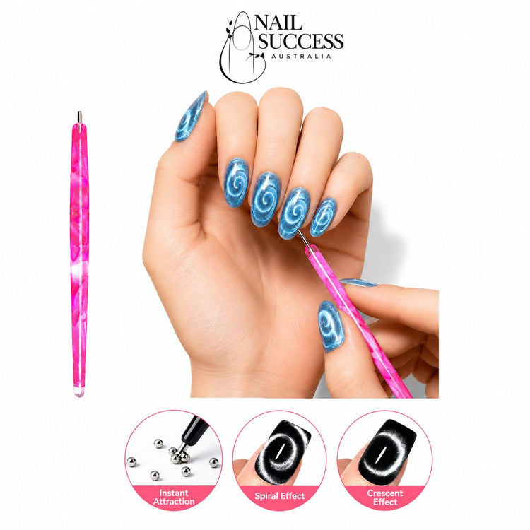 Pink marbled cat-eye magnetic pen creating spiral and crescent effects on blue gel polish nails – Nail Success Australia