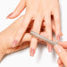 Silver cat-eye magnet bar tool creating a subtle shimmer effect in nude magnetic gel polish