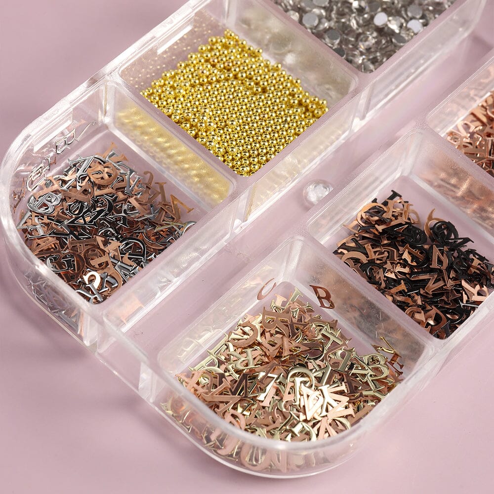 Metallic 3D nail art alphabet letters—gold, silver & rose-gold—plus caviar beads and rhinestones in organizer tray for manicure decoration