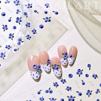 Mini Blueberry Embossed Nail Art Sticker sheet with blue berry and green leaf designs on French tip nail samples