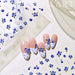 Mini Blueberry Embossed Nail Art Sticker sheet with blue berry and green leaf designs on French tip nail samples