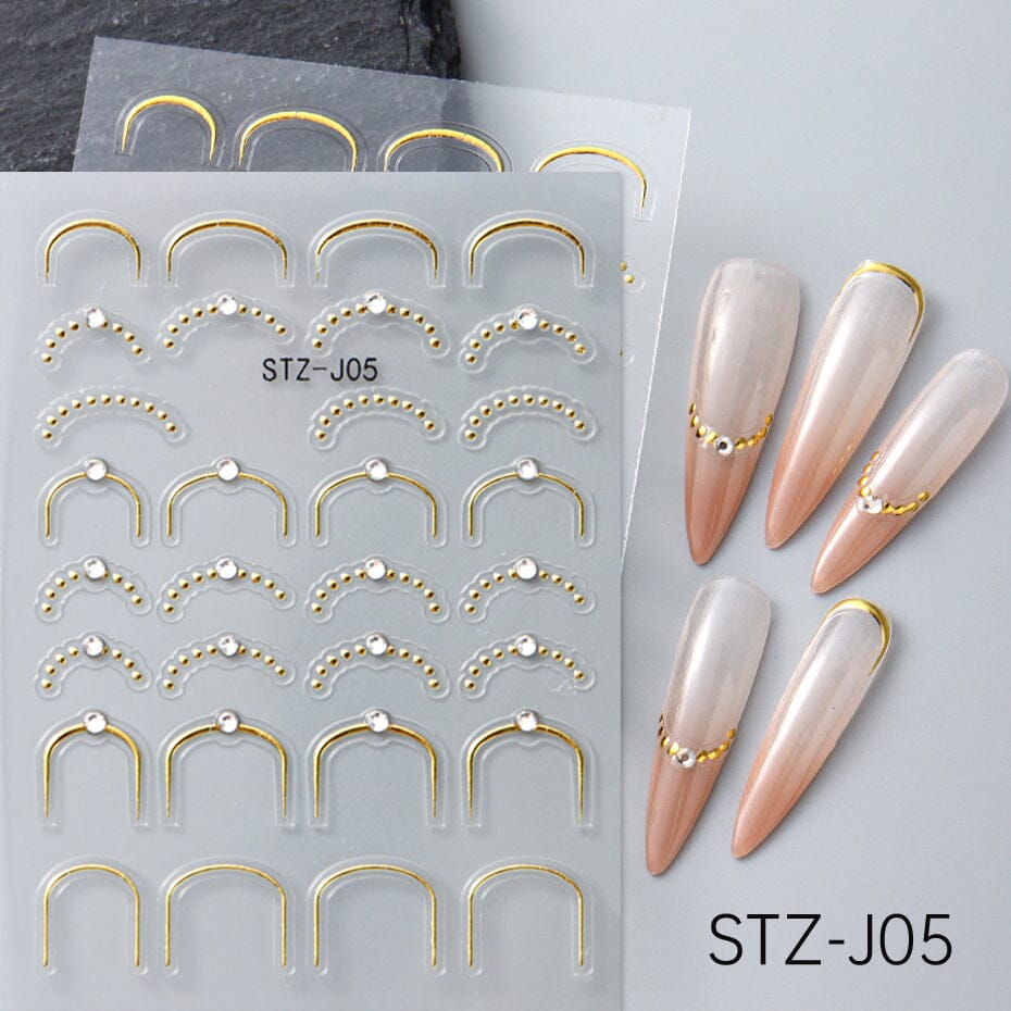 NSI Australia STZ-J05 Nail Art Stickers – gold French tip curve and U-frame decals with bead dots and crystal studs, self-adhesive, shown on sample nails