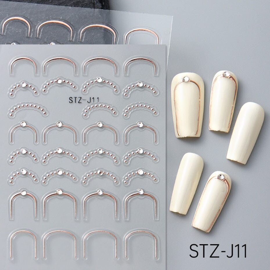 NSI Australia STZ-J11 Nail Art Stickers – rose gold U-frame and French tip curve decals with bead dots and crystal studs, self-adhesive, shown on sample nails