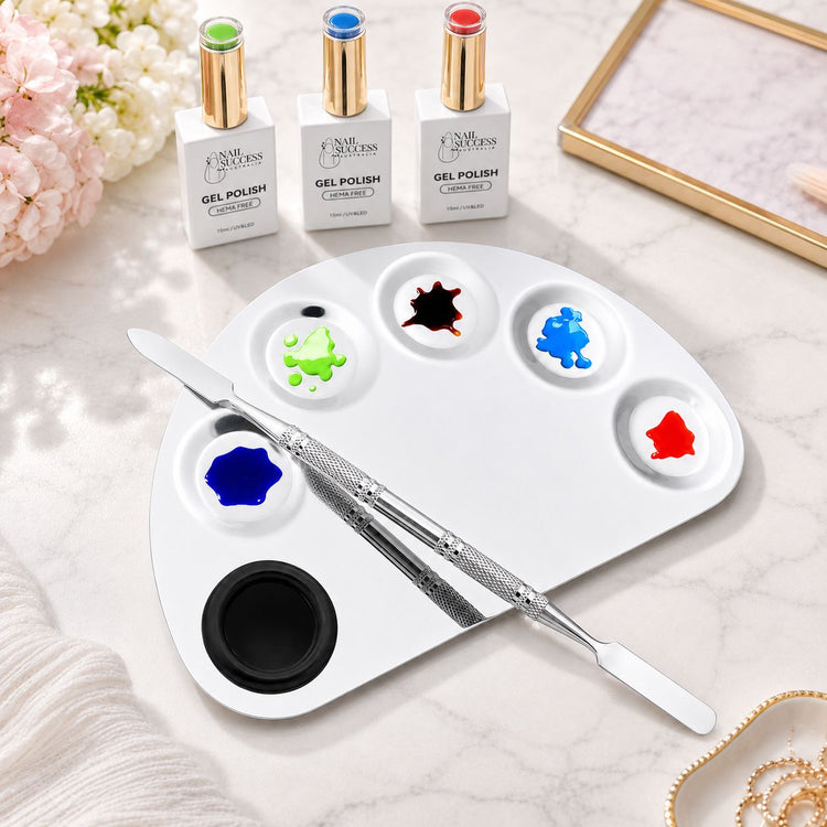 Half-moon stainless steel nail art colour mixing palette with spatula tool and gel polish colours for custom salon nail art blending