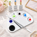 Half-moon stainless steel nail art colour mixing palette with spatula tool and gel polish colours for custom salon nail art blending